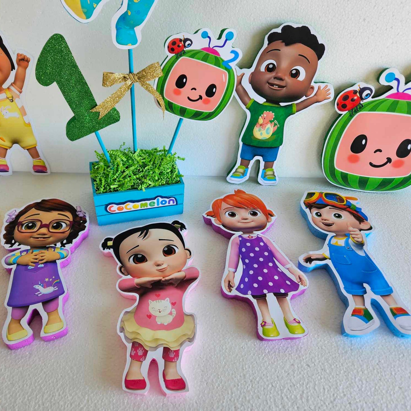 Cocomelon themed party decoration with printed foam cutout of JJ