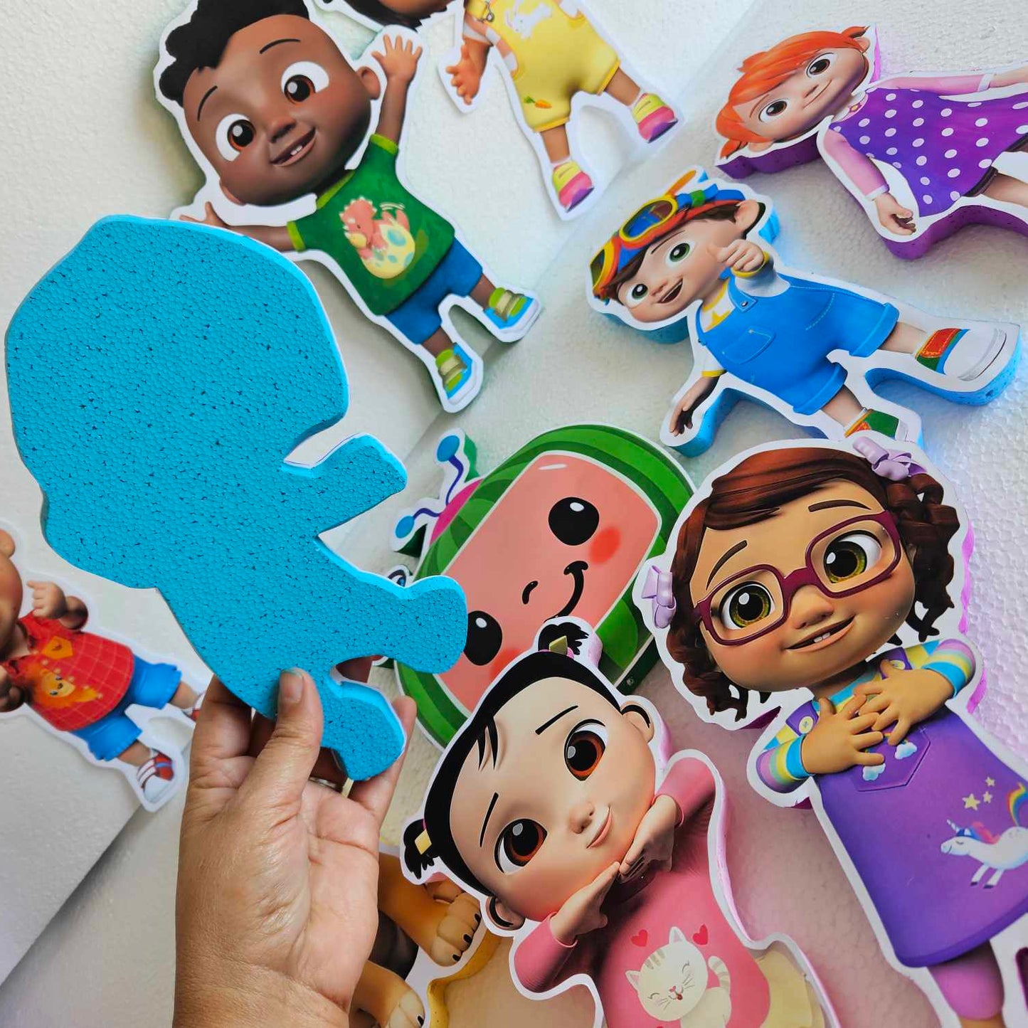 Cute Cocomelon party table centerpiece with JJ character cutout