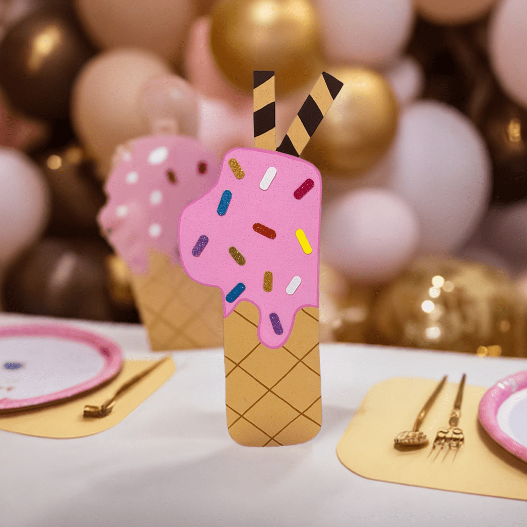 Birthday cutout of a melting ice cream shaped like the number 1, decorated with rainbow sprinkles and chocolate