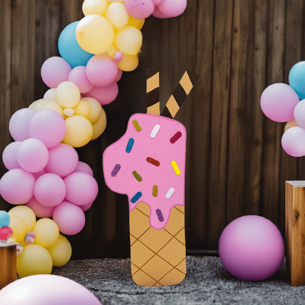 Cute number 1 ice cream cone cutout for birthday decor, with chocolate sauce and striped straws on top