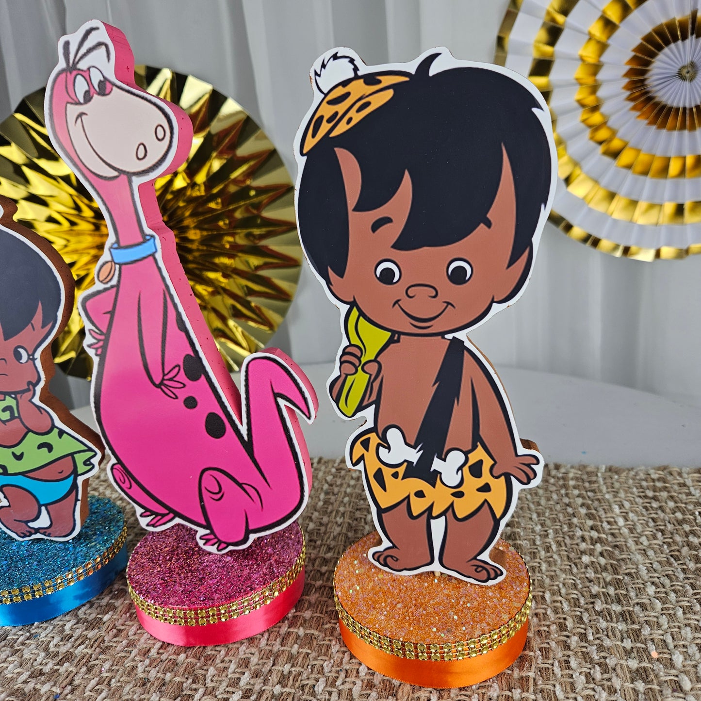 Bam Bam and Dino centerpiece for Flintstones birthday party