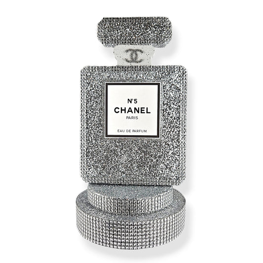 Luxury Chanel-themed birthday centerpiece with foam lipstick and perfume design, perfect for fashion-forward party decor
