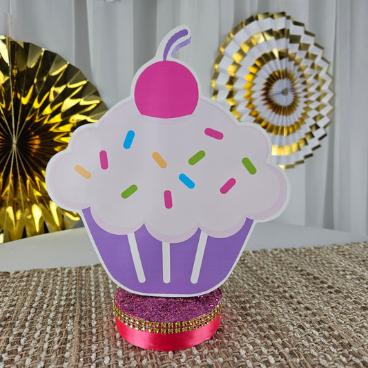 Pink and purple cupcake centerpiece made of glitter foam with matching ribbon and mesh on a round base