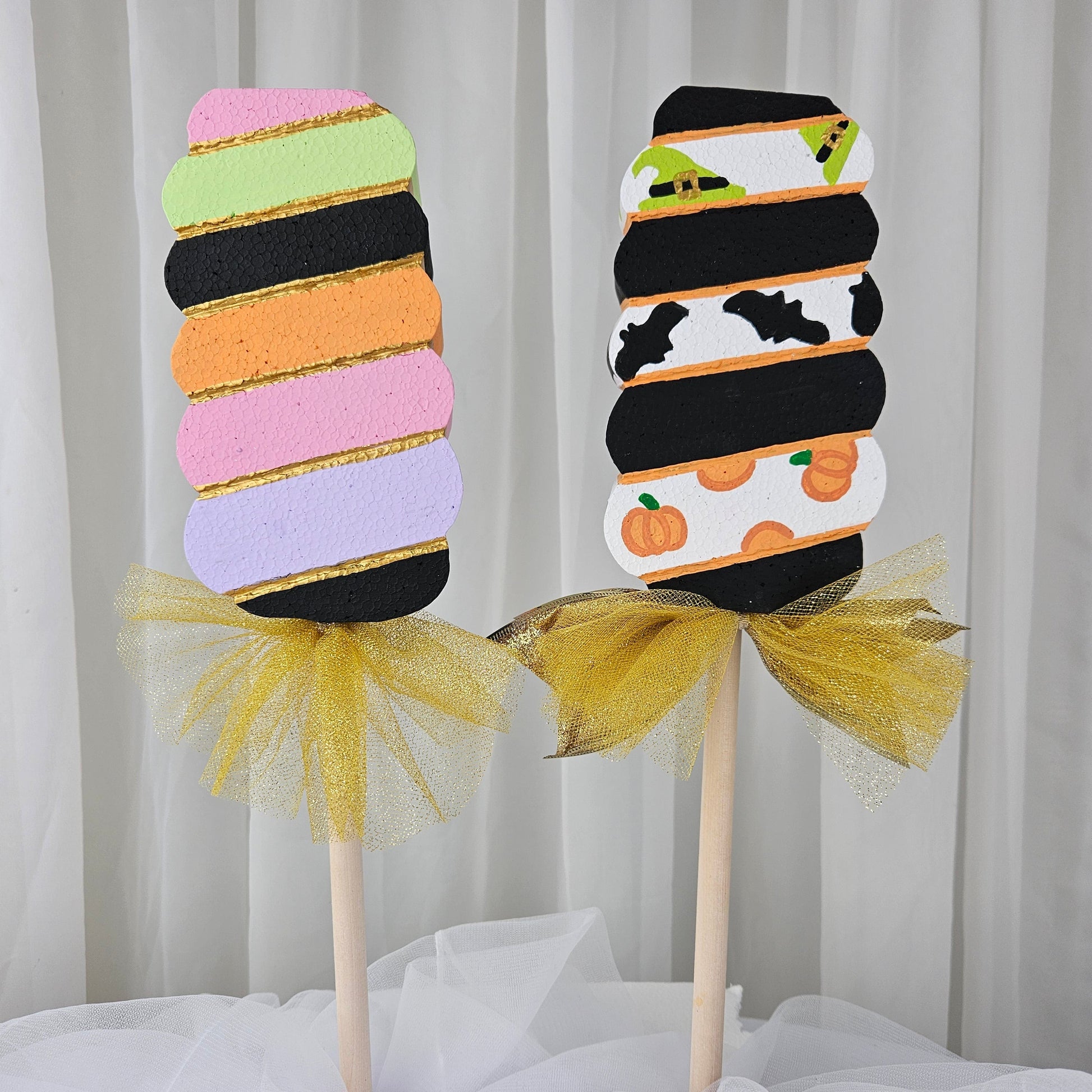 Handmade Halloween swirl lollipop stick used in a spooky party centerpiece – great for candyland themes

