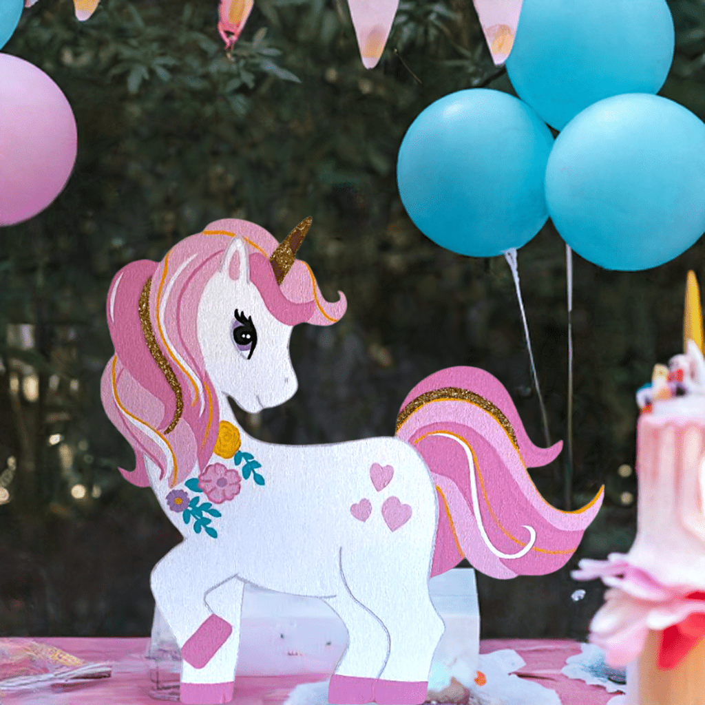 Large unicorn cutout featuring stars and clouds, ideal for kids’ party setups
