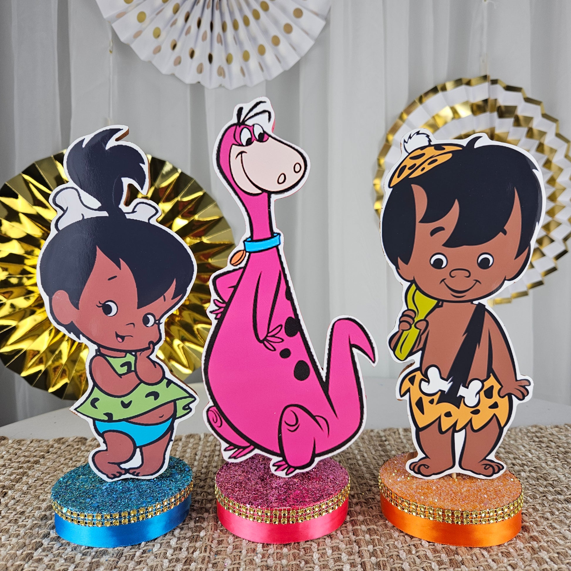 Colorful Flintstones party centerpiece set featuring African American characters