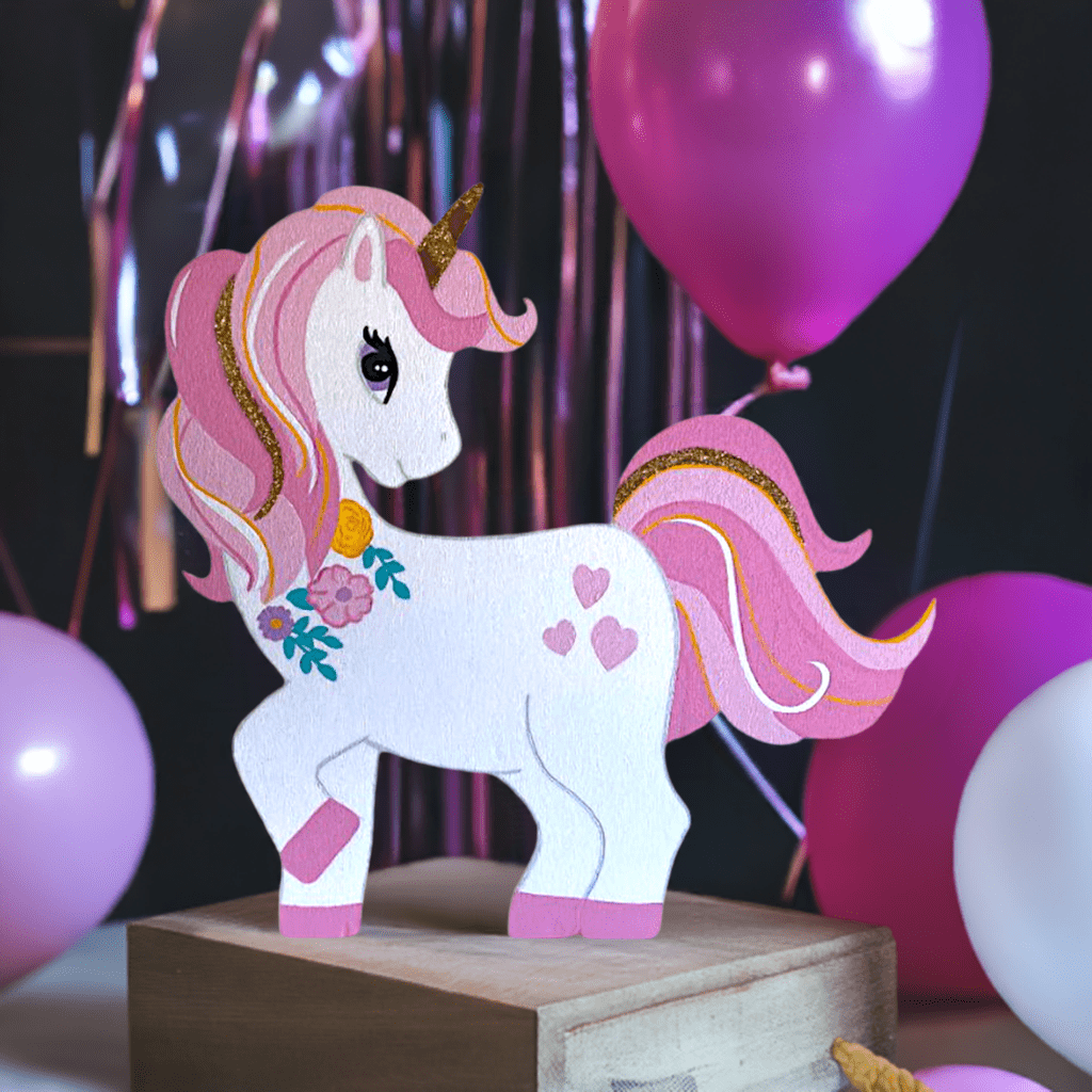 Rainbow-themed unicorn cutout with glitter details for table centerpieces or wall decor