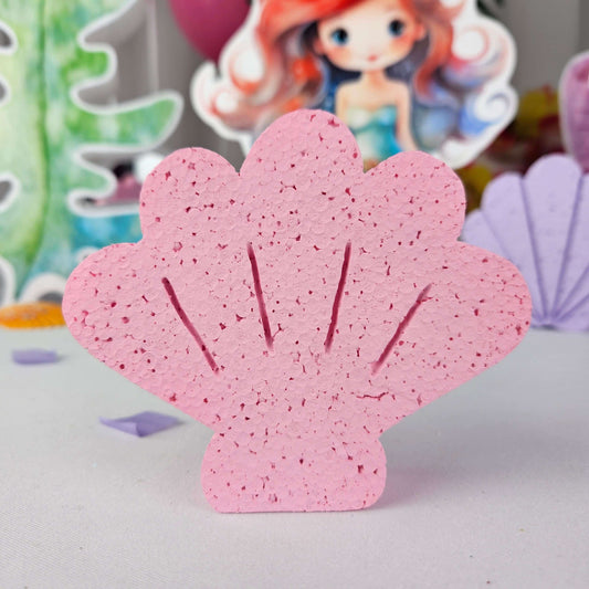 Handmade pink foam seashell cutout decoration for under the sea themed birthday party centerpiece.